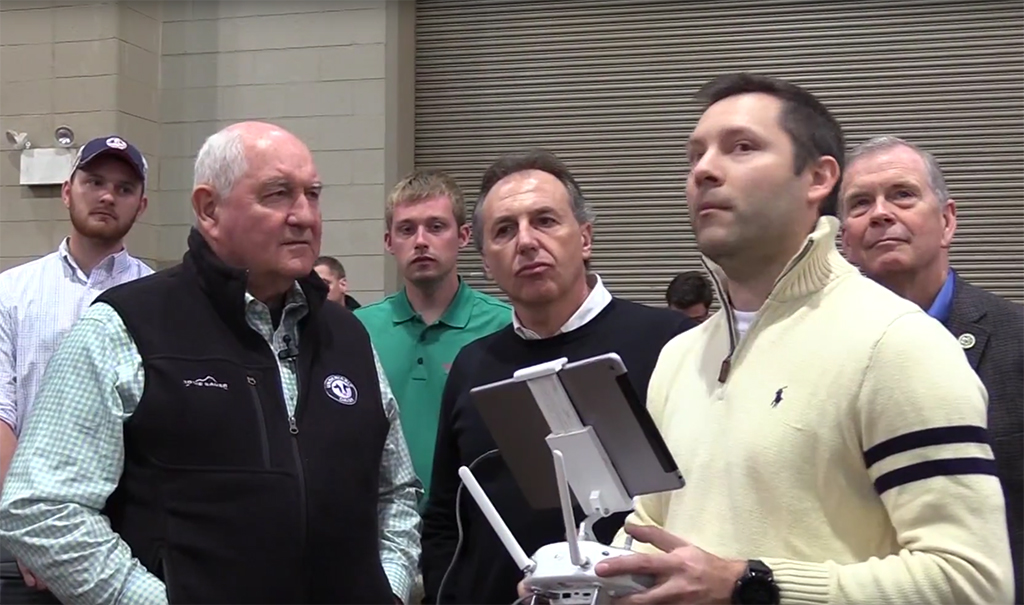 Bruno, Rich, and Sonny Perdue talking about the Lab's UAVs