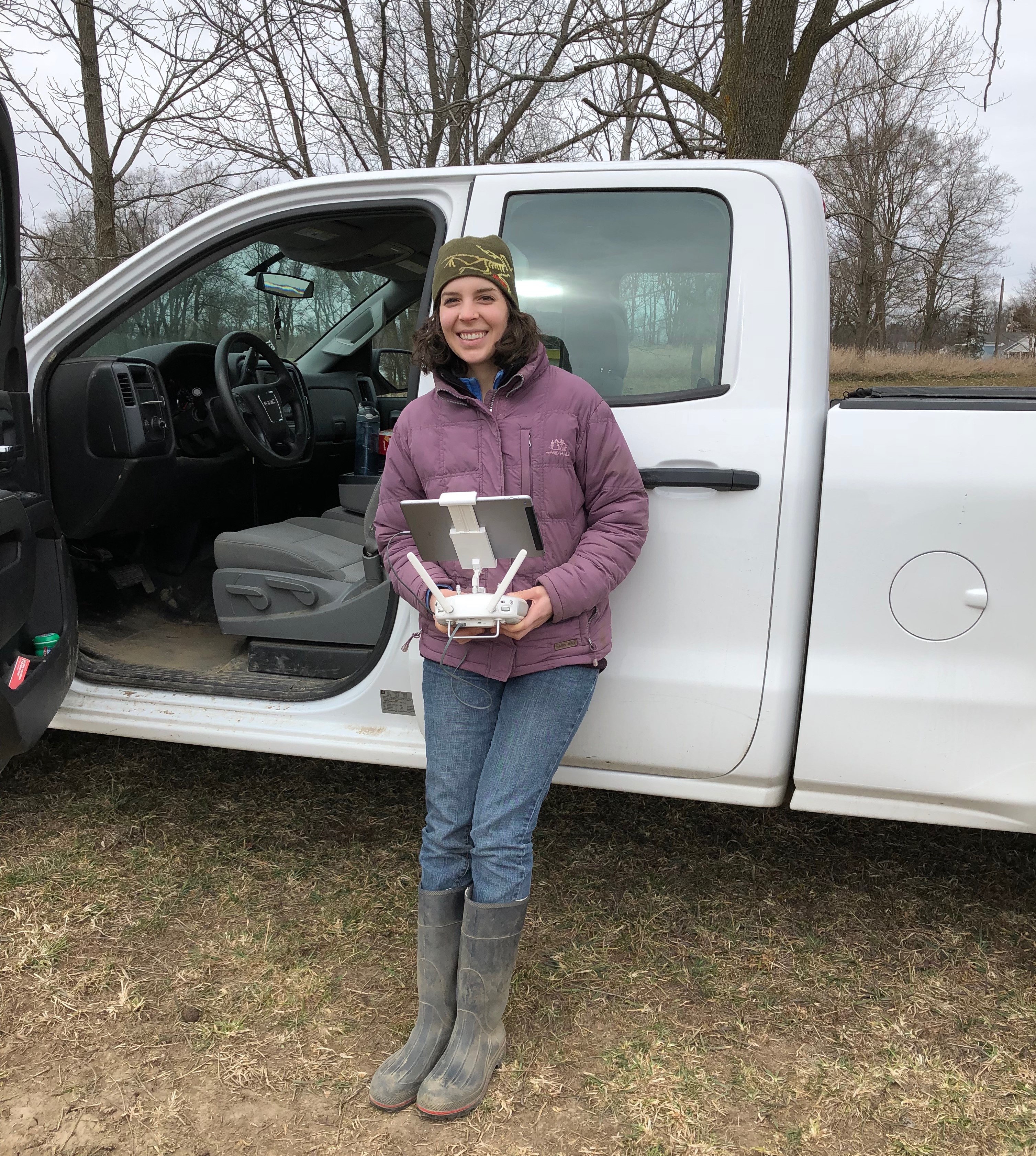 Lydia learning to fly the drone over a wheat field